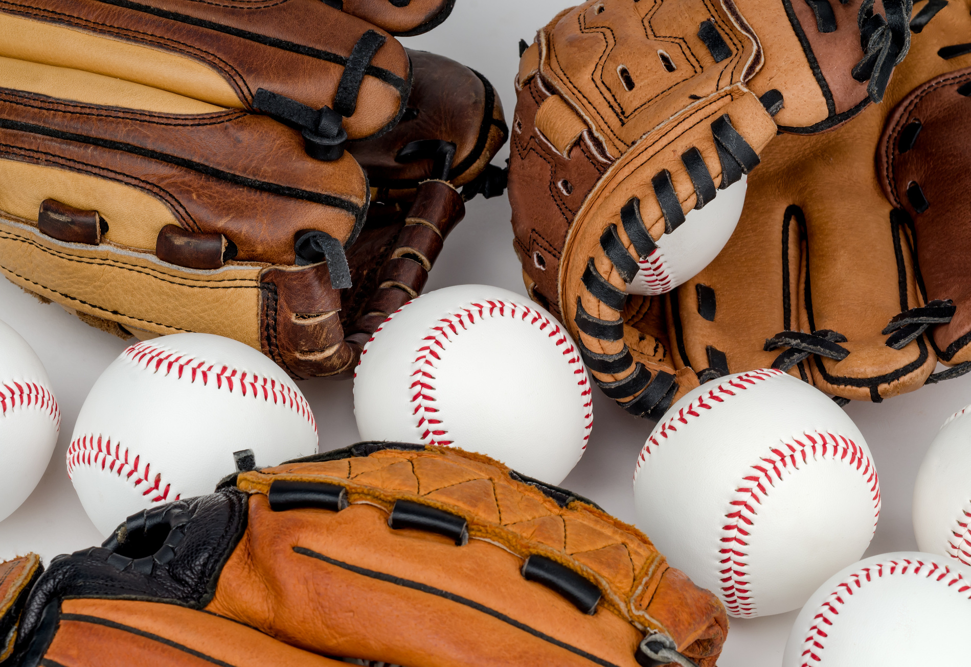 Collection of Baseball Gloves and Baseballs.